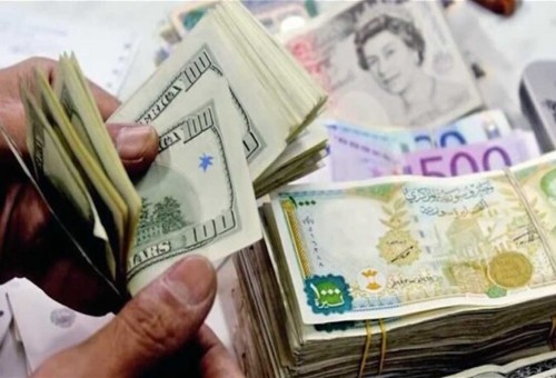 سوريا تخفض سعر عملتها أمام الدولار
